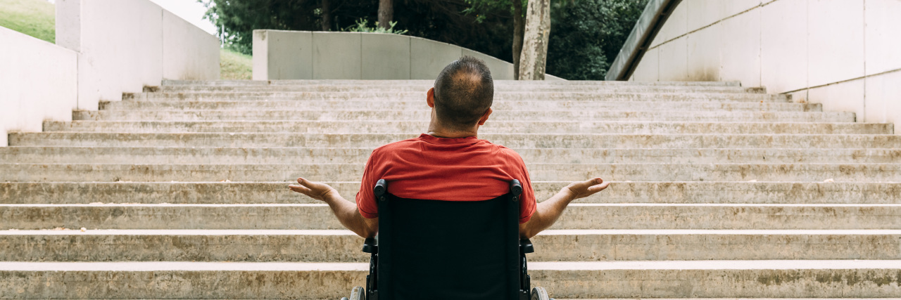 Why Financial Compensation From ADA Lawsuits Isn't 'Profiteering' Man in wheelchair outraged in front of stairs.