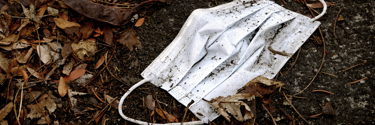 Face mask thrown on the ground.