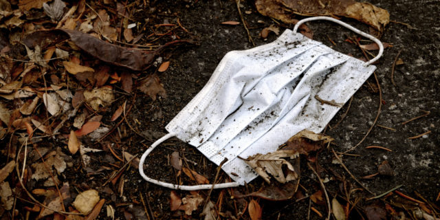 How 'Freedom Day' Feels as Someone With Chronic Illness in the U.K. Face mask thrown on the ground.