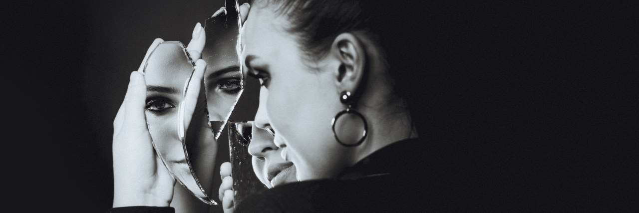 An Open Letter to My Disabled Body With Cerebral Palsy Woman holding broken mirror with reflection.