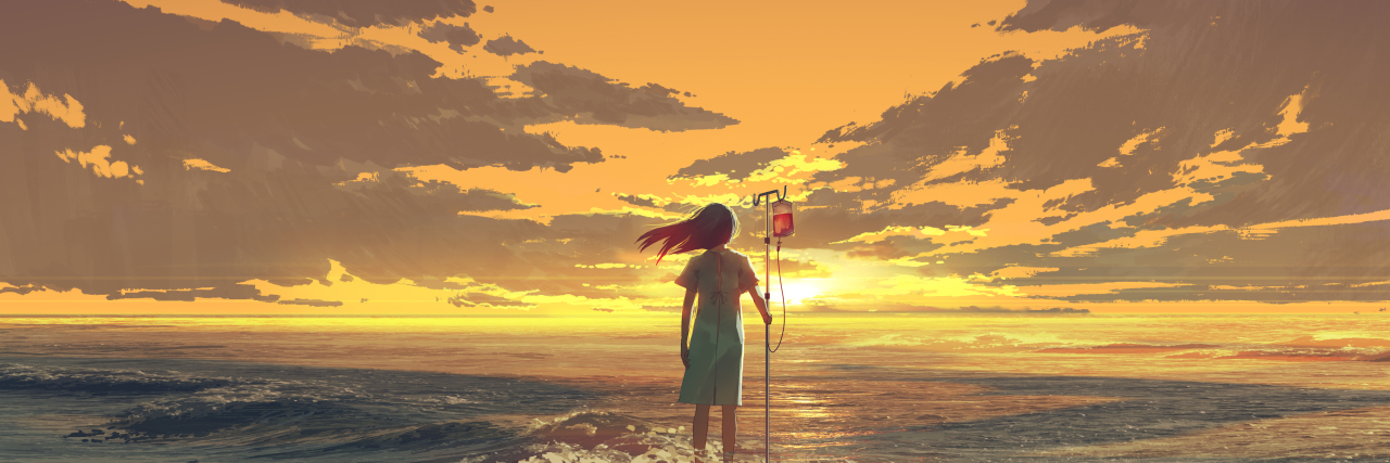 Woman with IV pole standing in the ocean.