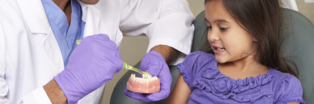 Dentist with child patient.