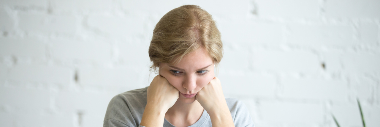 Adult ADHD Linked to Chronic Illnesses, According to Study A photo of a white woman with blonde hair sitting at her desk