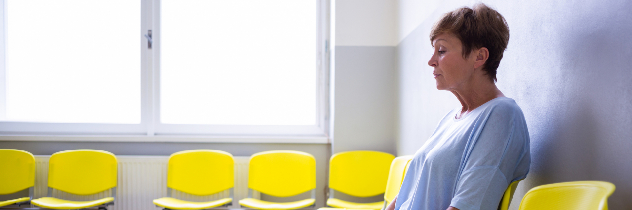 What to Expect While Inpatient at a Psychiatric Hospital Patient sitting in a waiting room