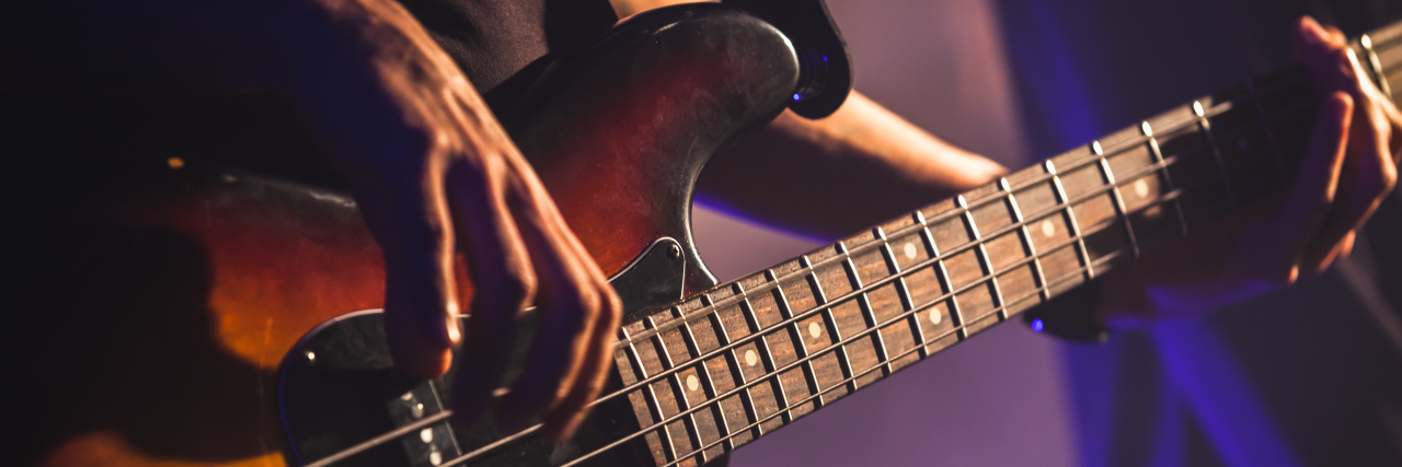 Mark Hoppus Reminds Us It's OK to Feel OK When You Have Cancer Close-up photo of bass guitar player.