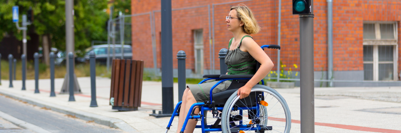 The Skills and Lessons I've Learned Because of My Disability Woman in wheelchair crossing the street.