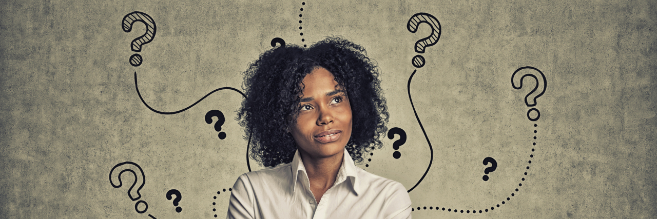 10 Things I Wish Others Knew About Being Undiagnosed Woman with question marks around her head.