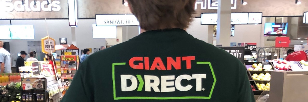 Why My Autistic Son Makes a Great Employee Kathy's son at work in a grocery store.