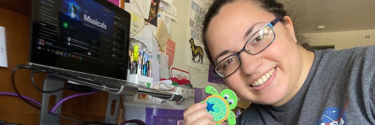 How Being Physically Sick Affects My Mental Health Photo of contributor holding craft projects of foam pieces that made little turtles
