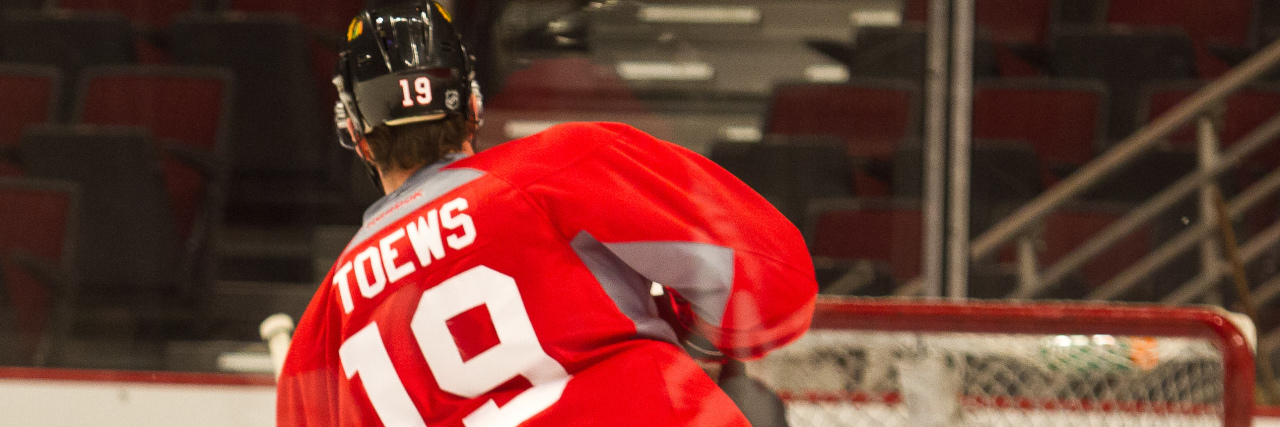 Hockey Player Shares Chronic Illness Diagnosis Jonathan Toews scoring a goal