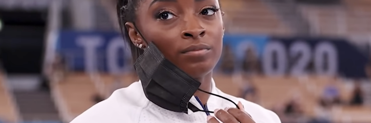 Simone Biles and Naomi Osaka Are Showing Good Mental Health Boundaries screengrab of Simone Biles removing her mask at the Olympic Games in Tokyo 2020