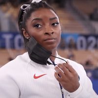 screengrab of Simone Biles removing her mask at the Olympic Games in Tokyo 2020