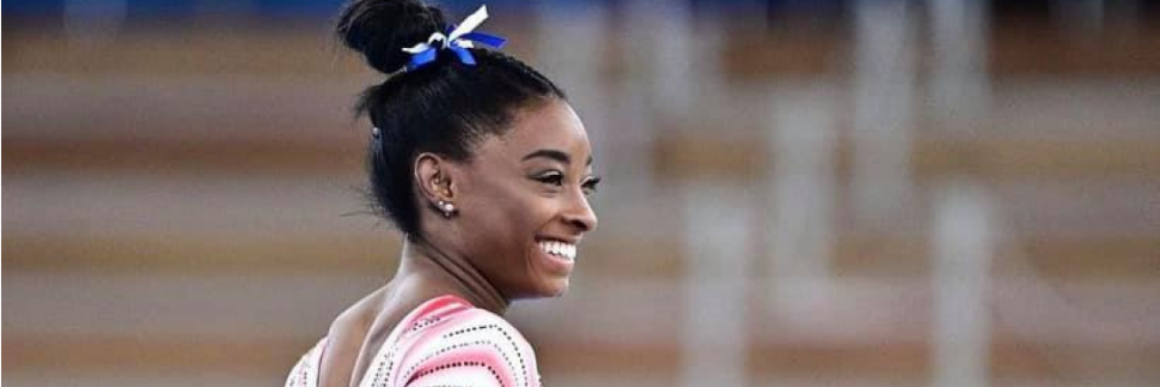 To the Critics of Simone Biles' Choice to Prioritize Her Mental Health Simone Biles in uniform, smiling