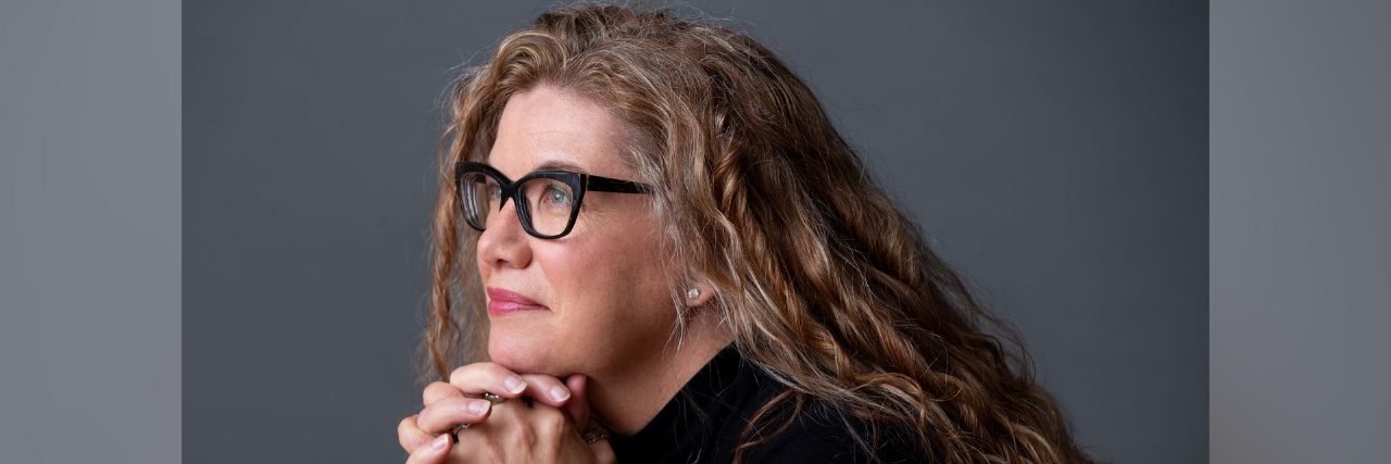 Why So Women Are Misdiagnosed and Dismissed by Doctors Headshot of author: middle-aged white woman with long blonde hair and glasses looking away from the camera