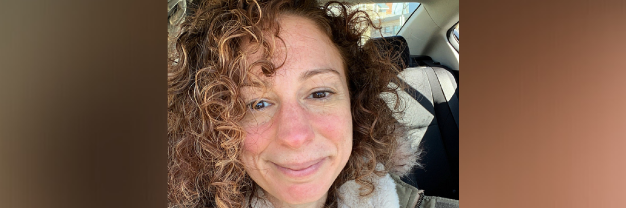 How I'm Using the Word 'And' to Co-Exist With My Anxiety Photo of contributor in the car, smiling at camera