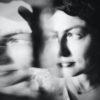 blurred black and white photo of a woman looking sad, double exposed
