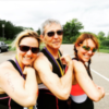 Photo of contributor, her father and her sister making a muscle before starting a triathlon