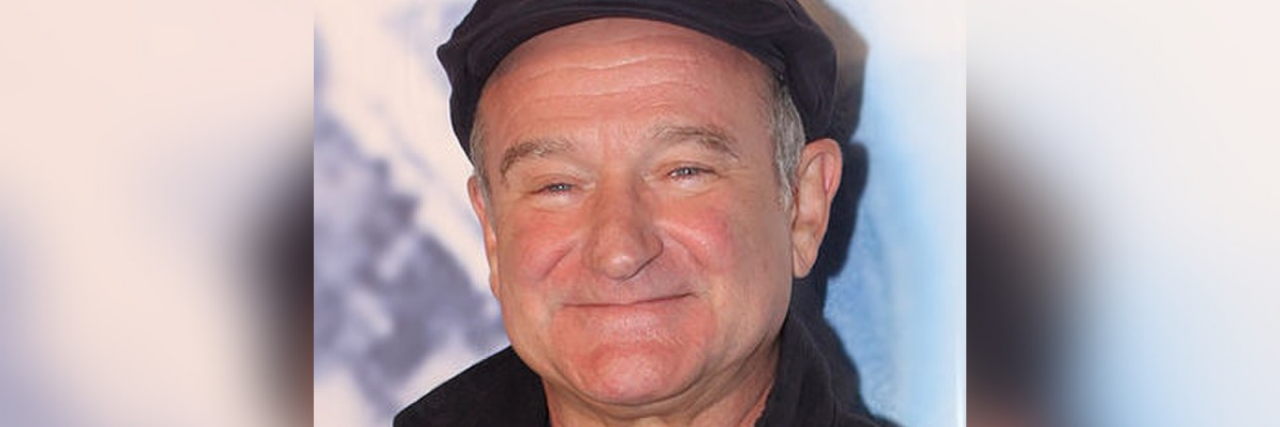 Robin Williams wearing a beret.