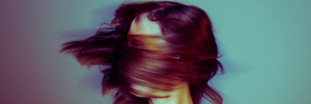 I Wish You Could Understand the Trauma Behind My 'Borderline Rage' Woman with red hair blowing across her face, looking away