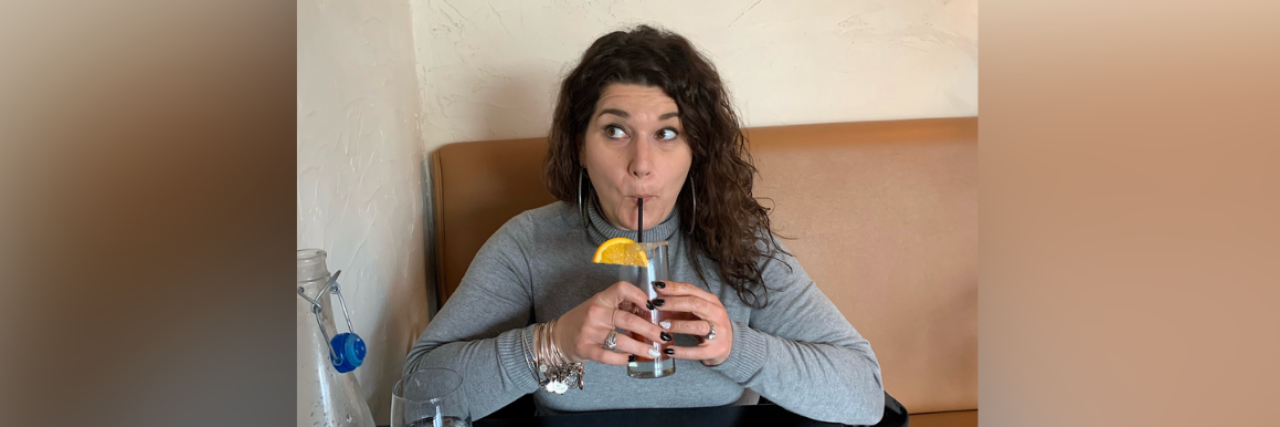 Searching For Answers and Finding a Brain Tumor Photo of contributor taking a sip from a drink with a straw and little umbrella