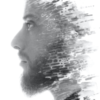 Double exposure portrait of man with face fading away