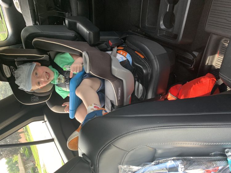 Jacquelyn's son sitting in a car seat.