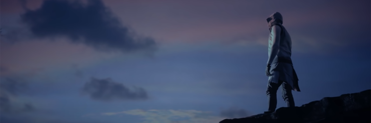 For King and Country's 'Shoulders' Uplifts People With Disabilities Man standing on a cliff looking at the sunset.