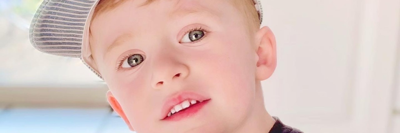 It’s OK to Have Hard Days as the Parent of an Autistic Child Jacquelyn's son holding a lollipop.