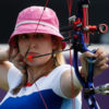Danielle is competing in London 2012 in archery. She is aiming her bow at the target.