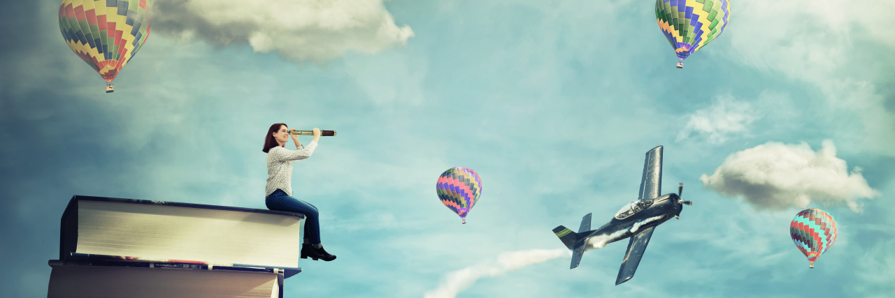 Developing a Rich Inner Life When Chronic Illness Limits Your Body Woman sitting on a pile of books imagining a fantasy world.