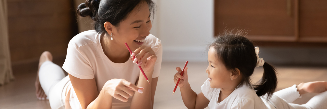 7 Ways Parents Can Support Their Children With Disabilities Mother and daughter drawing together.