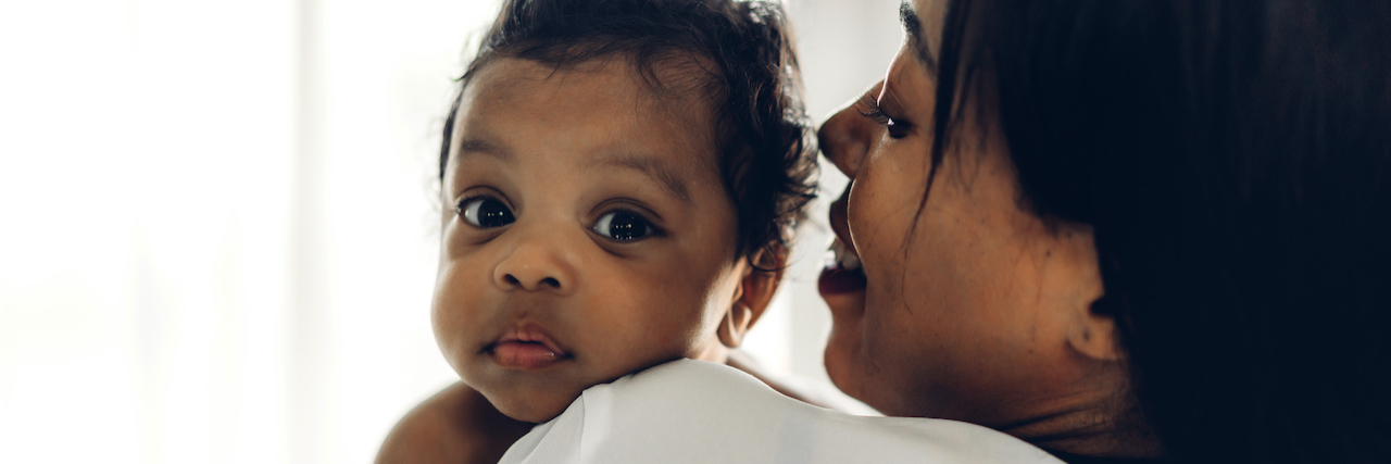 Why I Couldn't Breastfeed My Baby While on Bipolar Disorder Medication A mother holding her baby