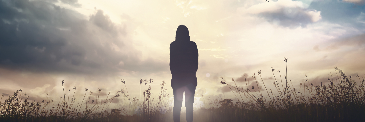 Things to Know After Being Diagnosed With Major Depressive Disorder woman standing in a meadow