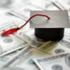 Graduation cap on united states dollar money