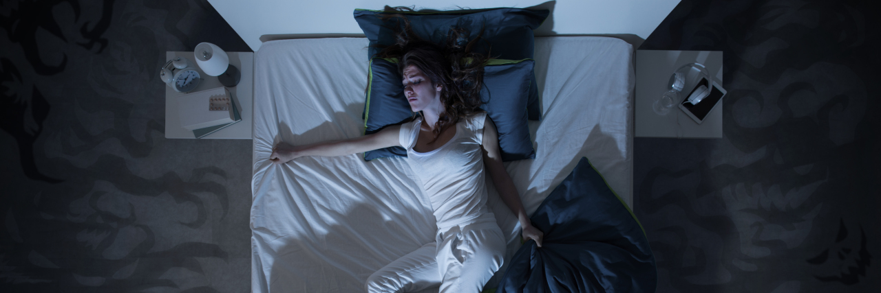 Living With Chronic Insomnia: Will I Ever Be Able to Sleep Again? Woman with insomnia trying to sleep.