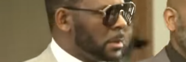 screenshot of R. Kelly wearing sunglasses during period of trial for sexual abuse allegations