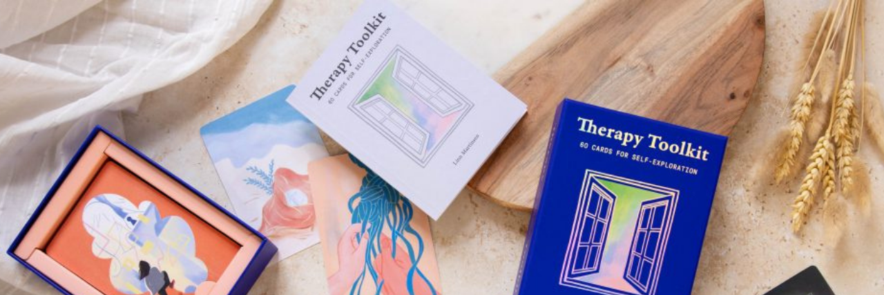 An Interview With Therapist Linn Martinsen on Her Therapy Toolkit Books and papers sprawled out on a tan sheet