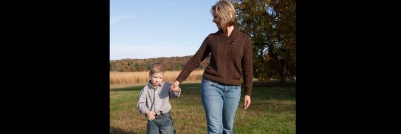 To My Courageous Son With Autism: You Are an Inspiration a mother and young son walking in a field