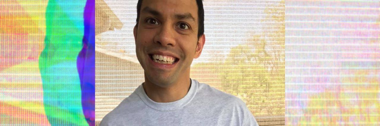 When I Struggle With Shame About Being on SSI Due to Cerebral Palsy Brandon wearing a martial arts t-shirt.