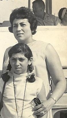 a black and white photo of a mother and daughter