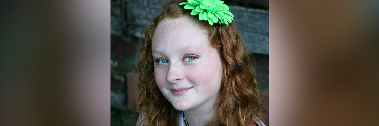 Trusting Myself and My Body With Chronic Illness Photo of young Hannah smiling (from 2013)