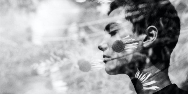 The Trauma of Having a Therapist Use Your Vulnerability Against You photo of a woman with short hair, double exposure with flowers