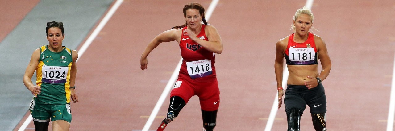 Photograph of Australian Paralympic team member Michelle Errichiello (1024) at the 2012 Summer Paralympic Games in London. Along with Errichiello are the United States' Katy Sullivan (1418) and Germany's Vanessa Low (1181) seen here contesting the final of the Women's 100 metre sprint (T44) on 5th September.