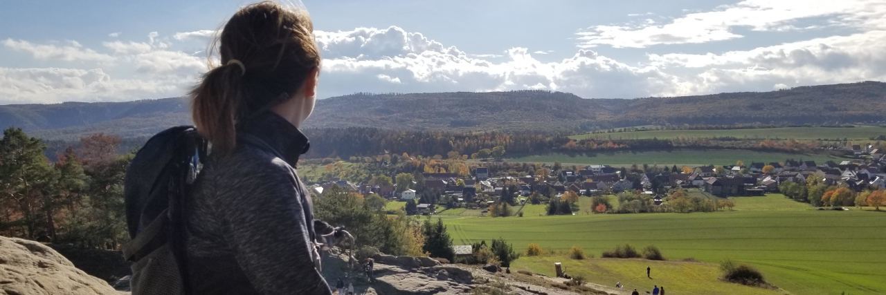 Lessons From My First Year After My Ehlers-Danlos Syndrome Diagnosis Celina looking out over a village in Germany.
