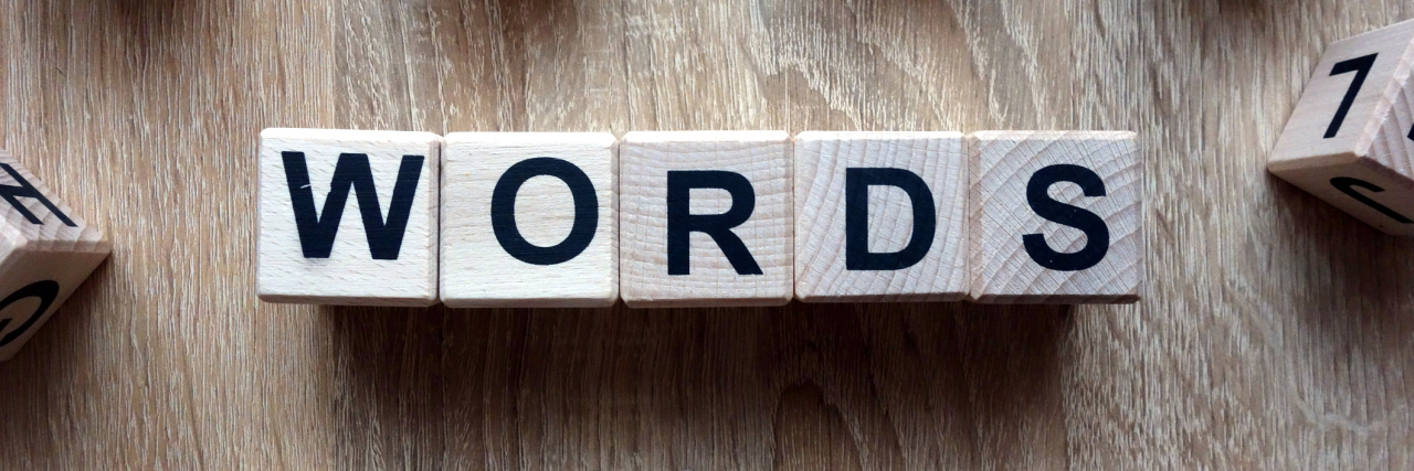 Words text from wooden blocks on desk
