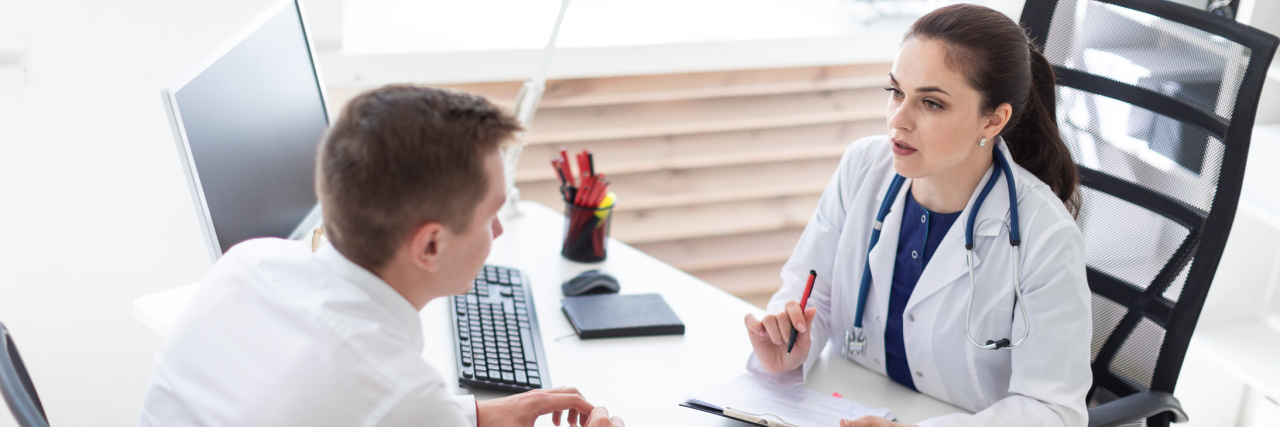 Getting to Know My Treatment Team Sets My Mental Health for Success Female doctor and male patient sitting across from each other talking