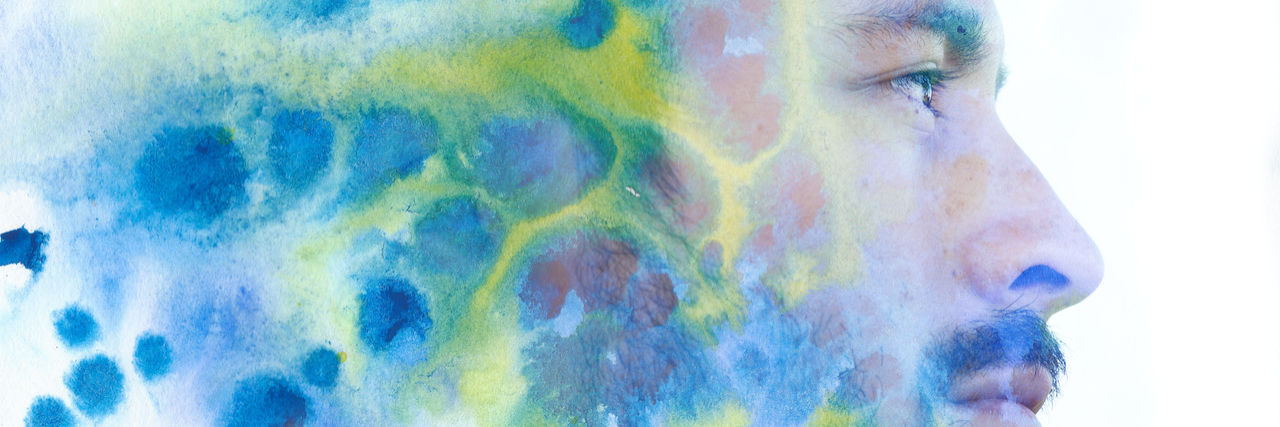 Notes on Learning to Live With Depression Paintography double exposure portrait of a man with strong features combined with painting of colorful cloudy ink brushstrokes and splatter