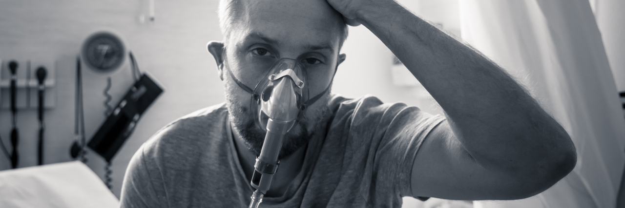 Man wearing oxygen mask.