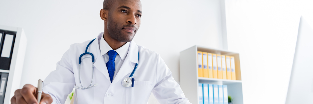 How to Choose the Right Doctor to Get More From Your Appointments Doctor using a laptop computer.