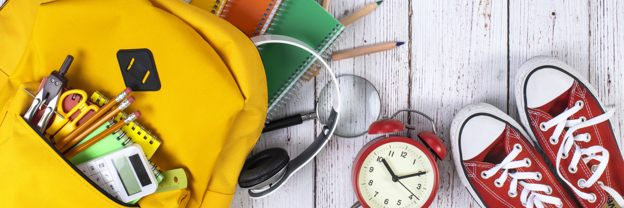 Back to School With Depression: 6 Tips to Manage Your Mental Health Back to school as a student with depression -- backpack with school supplies.